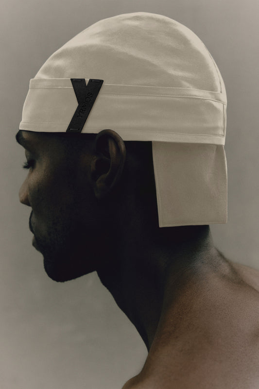 Ivory YRMOS durag worn on model, hand-tailored London silk, seamless fit, elegant drape, and knot-less loop design. - Ivory